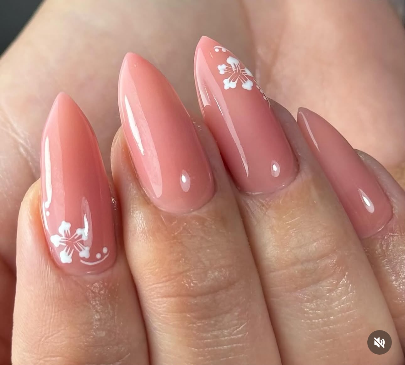 Pink almond nails with delicate white floral art